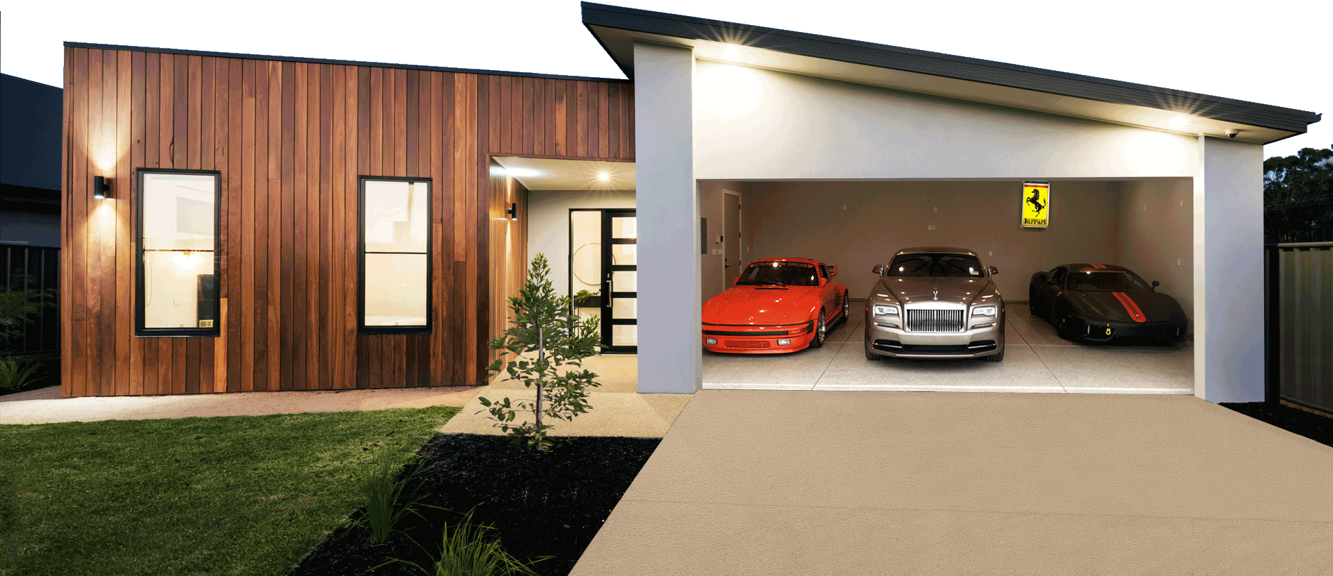 Modern home exterior at dusk with a wooden facade and warm lighting, featuring a driveway leading to an open garage showcasing three luxury cars: a bright orange sports car on the left, a silver luxury sedan in the center, and a black sports car on the right. A Ferrari logo is visible on the wall above the black car.